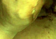 A husband gives his wife a handjob leading to a cumshot in their bedroom.