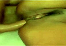 Brunette mommy with big boobs and a huge clitoris in the video