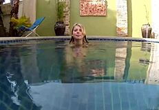 Pretty blonde Wendy swims naked in the pool