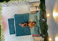 Monika fox poses naked on the bed.