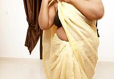 Chubby asian aunty showing boobs.