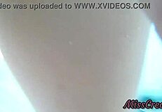 Teen student swims in the public pool with friends nearby