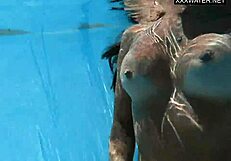The best MILF of all time, Angelica, swims naked in the pool