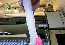Slender beauty shows off her ass and panties while trying on shoes