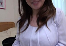 Beautiful Japanese woman with natural big boobs in bedroom scene