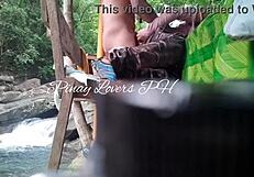 Hot milf and her young boyfriend have sex in a public waterfall cottage