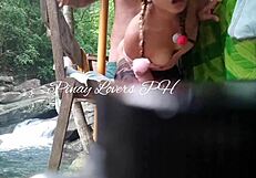 Hot milf and her young boyfriend have sex in a public waterfall cottage