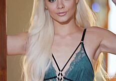 Elsa Jean undresses slowly, teasing her tattooed body before masturbating.