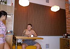 A brunette wife cheats on her husband with a young neighbor, gagging on his cock and achieving orgasm in a homemade scene.