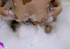 i love watching this cute babe suck that huge dildo in the bath