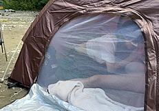 Amateur college girl holds back voice during tent fellatio in outdoor camp