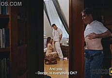 Married man watches his wife get treated by a doctor in a hospital