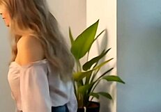 Beautiful blonde woman flaunts her assets for seduction