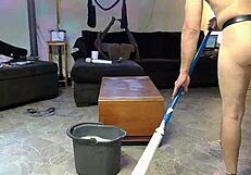 Horny gay nudist cleans his house while playing with anal toys