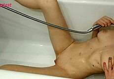 young milf showers while boyfriend films her small tits