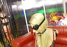 Bound babe in cage, blindfolded for BDSM fetish