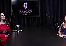 Annie Clementine humiliates in podcast with Bia Hot, handjob in see-through lingerie outdoors.