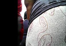 I watch my peruvian neighbor doing her shopping.