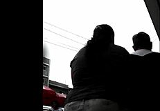 I watch my peruvian neighbor doing her shopping.