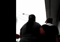 I watch my peruvian neighbor doing her shopping.