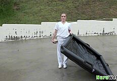 Lovely teen blonde masseuse rubs her naked wet body against client in nuru gel session.