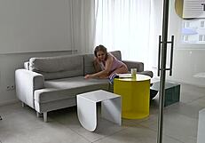 horny blondie browsing through fashion magazines