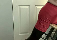 Skinny girl grinding ass on stool in black tights and red shorts, fetish style