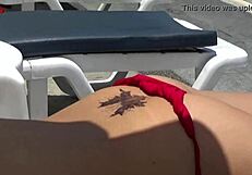 Sexy babe jennymarie flashes wet bikini tits in public outdoor exhibition