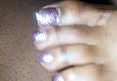 toes teasing a cock with footjob action