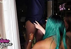 Two British teens on their knees, sharing a huge cock to suck