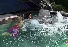 Stunning outdoor pool sex with blonde and busty brunette lesbians