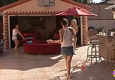 Three hot babes enjoying the garage with supercars