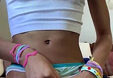 Petite young girl plays with her body