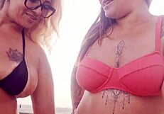 Flashing at the beach with my naughty friend. Ready to take that virgin boy's innocence?