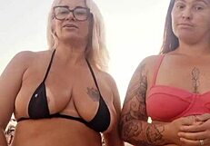 Flashing at the beach with my naughty friend. Ready to take that virgin boy's innocence?