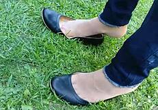 Enjoying shoeplay and dipping in tan nylons with flats