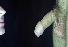 A girl sucks dick from the inside of the mouth, showcasing passionate close-ups