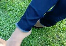 Enjoying shoeplay and dipping in tan nylons with flats