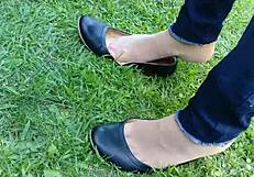 Enjoying shoeplay and dipping in tan nylons with flats