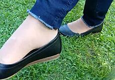 Enjoying shoeplay and dipping in tan nylons with flats