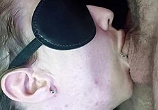 A girl sucks dick from the inside of the mouth, showcasing passionate close-ups