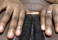 a black girl with a hairy pussy masturbates alone