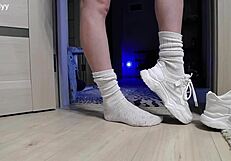delicate legs in sneakers waiting