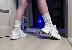 delicate legs in sneakers waiting