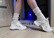 delicate legs in sneakers waiting