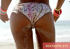 sexy beach hottie in bikini shows off her curves