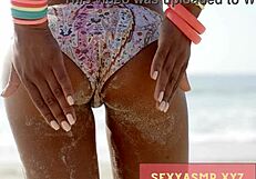 sexy beach hottie in bikini shows off her curves