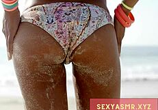 sexy beach hottie in bikini shows off her curves