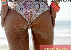 sexy beach hottie in bikini shows off her curves