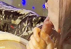 Lactating woman milks uncut cock with handjob in mouth.